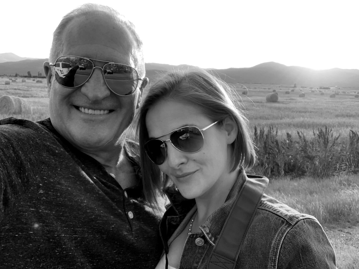 Kevin Seney and his wife Carrie outdoors at sunset