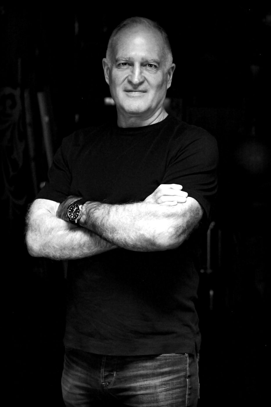 Kevin Seney, black-and-white portrait, arms crossed