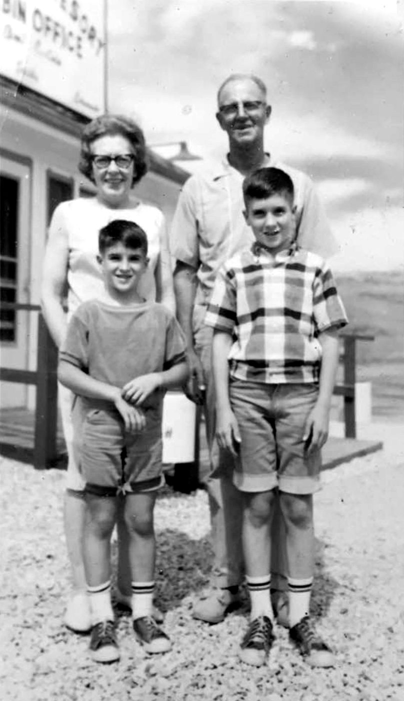 Kevin and his brother Sid as boys, standing with their grandparents Frank and Ruth Seney
