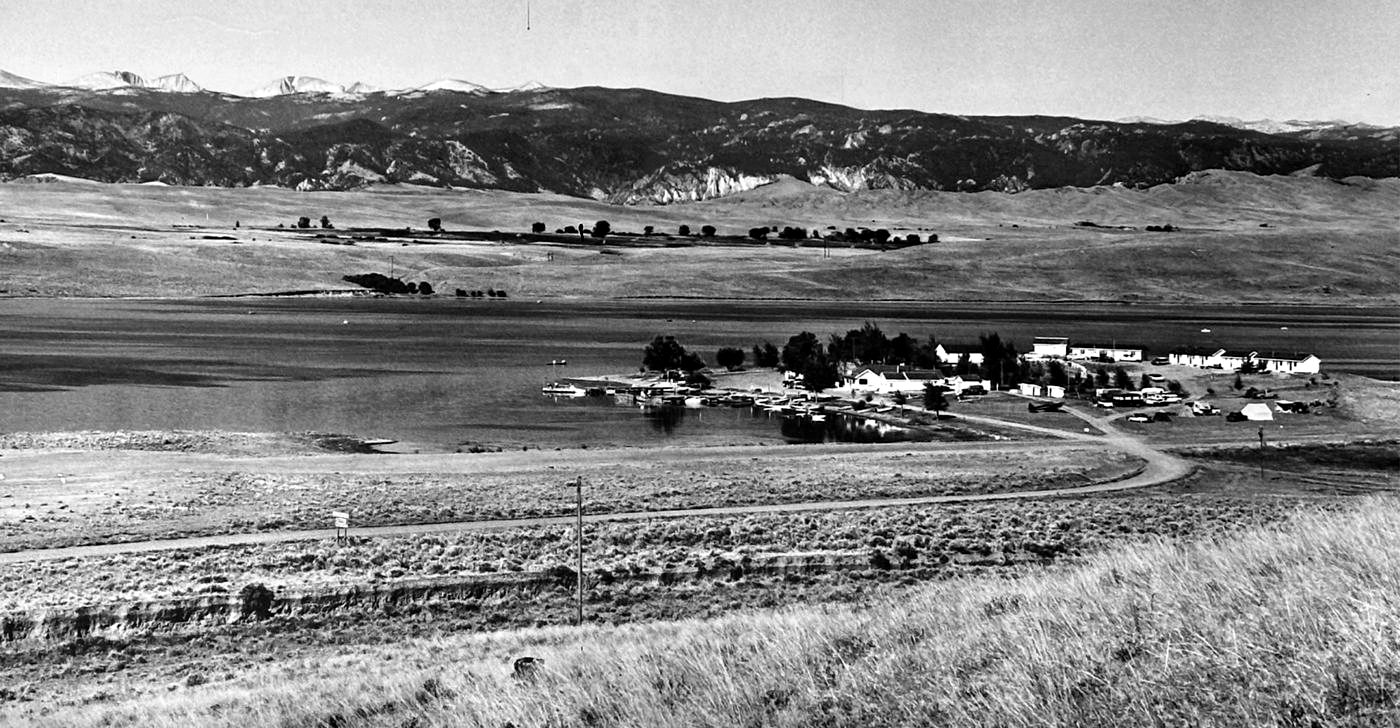 Seney Point on the shore of Lake De Smet, Wyoming, with the Bighorn Mountains behind, black and white